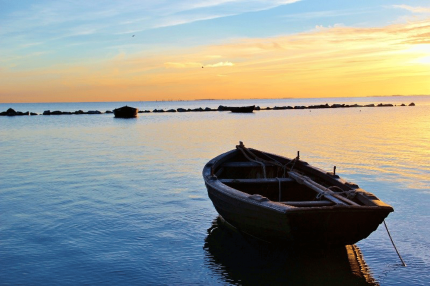 Small fishing boats at sunset - Photo by Eckhard Wolfgramm 